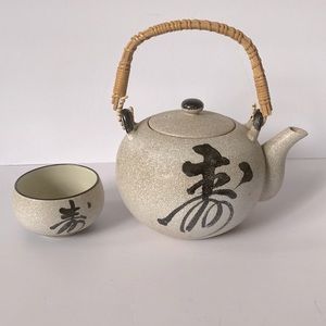 Ceramic tea pot with cup